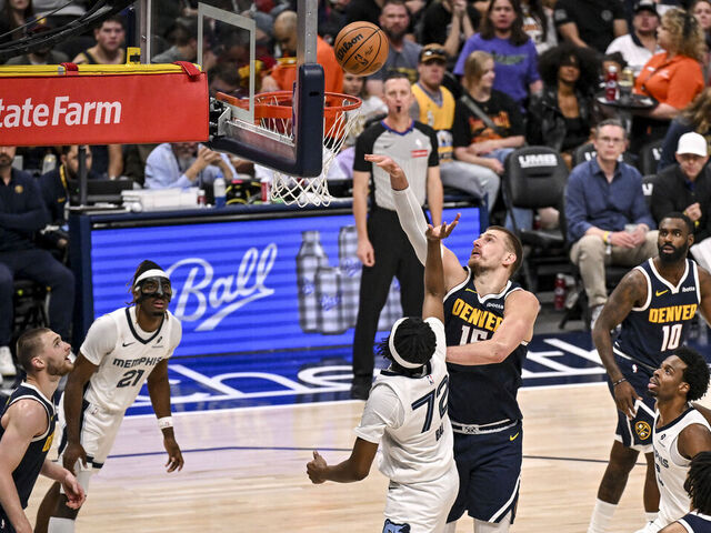 DENVER , CO - APRIL 8: Nikola Jokic (15) of the Denver Nuggets defends Adama Bal (72) of the Memphis Grizzlies during the third quarter of the Nuggets' 136-119 win at Ball Arena in Denver, Colorado on Wednesday, April 8, 2026.