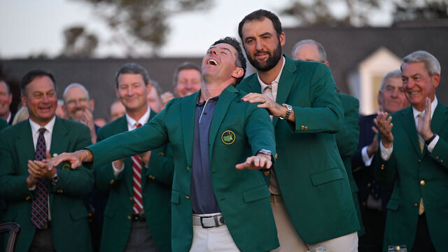 AUGUSTA, GEORGIA - APRIL 13: Rory McIlroy of Northern Ireland is awarded the green jacket by Scottie Scheffler during the green jacket ceremony, after final round of Masters Tournament at Augusta National Golf Club on April 13, 2025 in Augusta, Georgia.