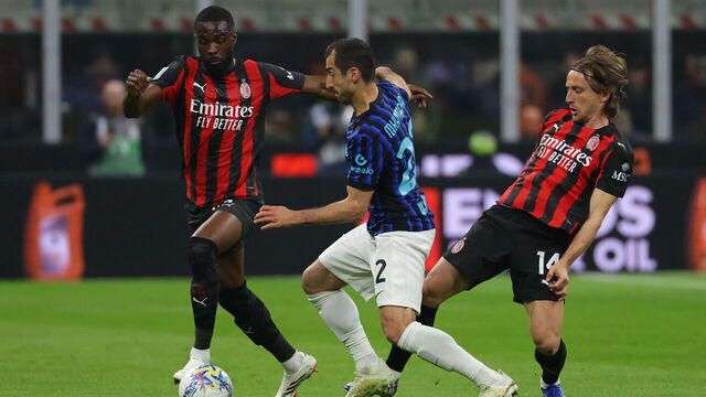 MILAN, ITALY - MARCH 08: Henrikh Mkhitaryan of FC Internazionale is challenged by Fikayo Tomori of AC Milan and Luka Modric of AC Milan during the Serie A match between AC Milan and FC Internazionale at Giuseppe Meazza Stadium on March 08, 2026 in Milan, Italy.