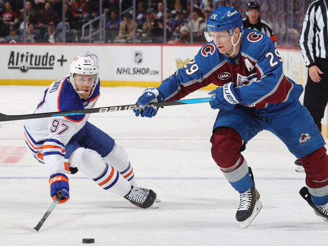 DENVER, COLORADO - MARCH 10: Nathan MacKinnon #29 of the Colorado Avalanche skates against Connor McDavid #97 of the Edmonton Oilers at Ball Arena on March 10, 2026 in Denver, Colorado.