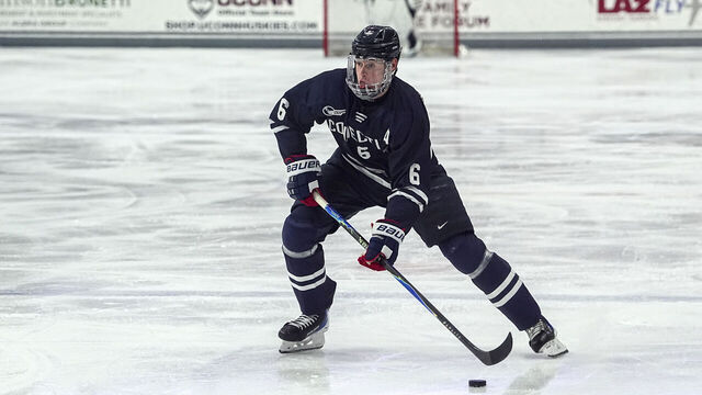 STORRS, CONNECTICUT - NOVEMBER 14: Viking Gustafsson Nyberg #6 of University of Connecticut passes the puck during a game between Northeastern University and University of Connecticut at Toscano Family Ice Forum on November 14, 2025, in Storrs, Connecticut.