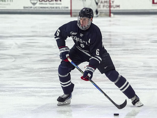 STORRS, CONNECTICUT - NOVEMBER 14: Viking Gustafsson Nyberg #6 of University of Connecticut passes the puck during a game between Northeastern University and University of Connecticut at Toscano Family Ice Forum on November 14, 2025, in Storrs, Connecticut.