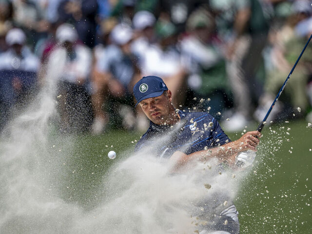 Bryson DeChambeau of the United States plays a stroke from a bunker on the No. 11 hole during the first round of the Masters at Augusta National Golf Club, Thursday, April 09, 2026.