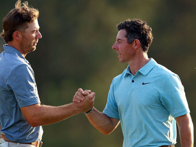 AUGUSTA, GEORGIA - APRIL 06: Sam Burns of the United States shakes hands with Rory McIlroy of Northern Ireland on the 18th green during the first round of the 2023 Masters Tournament at Augusta National Golf Club on April 06, 2023 in Augusta, Georgia.