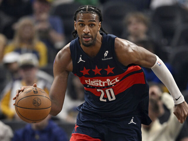 SAN FRANCISCO, CALIFORNIA - MARCH 27: Alex Sarr #20 of the Washington Wizards dribbles against the Golden State Warriors in the first quarter at Chase Center on March 27, 2026 in San Francisco, California.