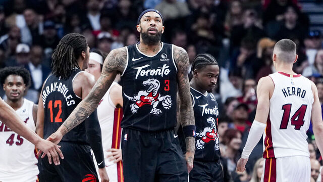 TORONTO, CANADA - APRIL 9: Brandon Ingram #3 and Scottie Barnes #4 of the Toronto Raptors celebrate against the Miami Heat during the first half at the Scotiabank Arena on April 9, 2026 in Toronto, Ontario, Canada. NOTE TO USER: User expressly acknowledges and agrees that, by downloading and/or using this Photograph, user is consenting to the terms and conditions of the Getty Images License Agreement.