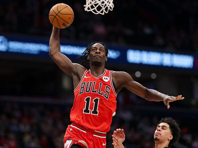 WASHINGTON, DC - APRIL 09: Leonard Miller #11 of the Chicago Bulls goes to the basket against Will Riley #27 of the Washington Wizards during the first half at Capital One Arena on April 9, 2026 in Washington, DC.