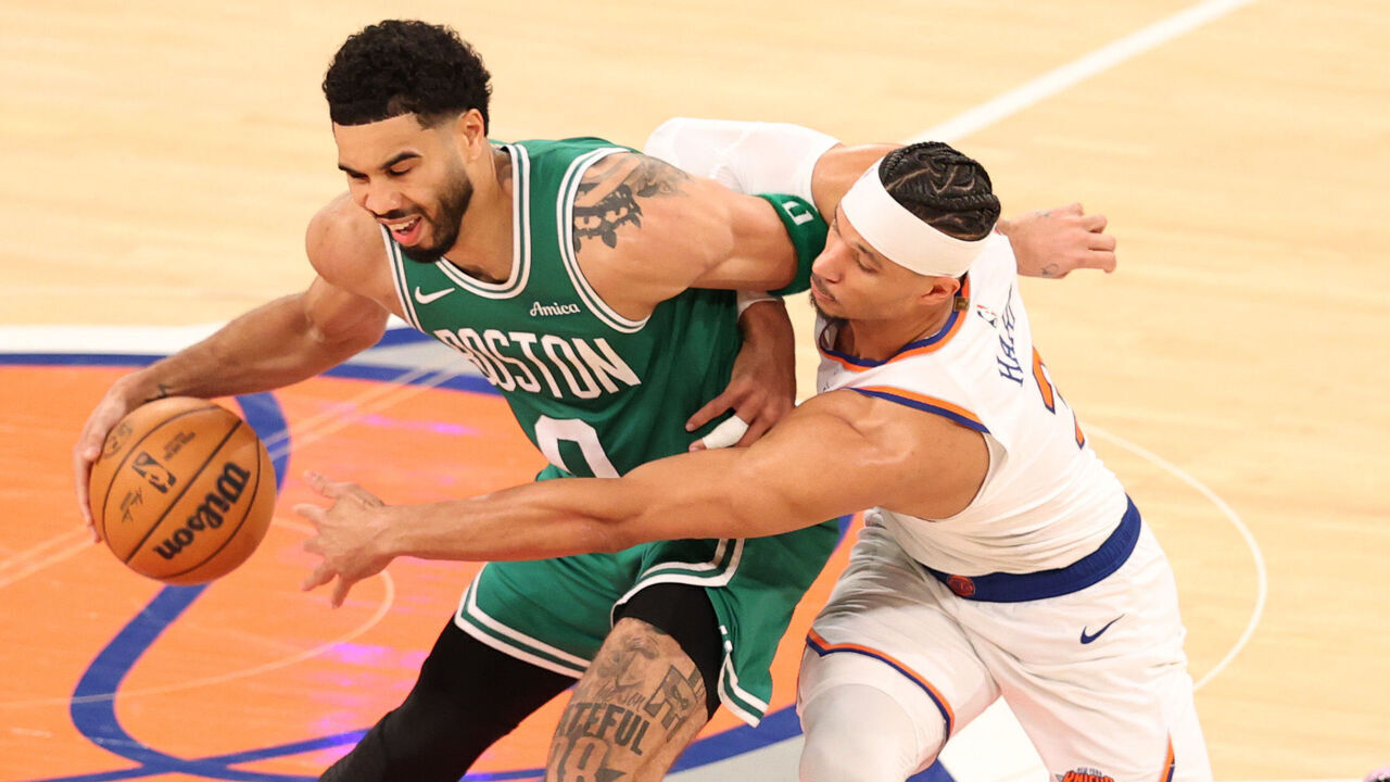 NEW YORK, NEW YORK - APRIL 09: Josh Hart #3 of the New York Knicks attempts to steal the ball from Jayson Tatum #0 of the Boston Celtics during the fourth quarter at Madison Square Garden on April 09, 2026 in New York City.