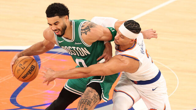 NEW YORK, NEW YORK - APRIL 09: Josh Hart #3 of the New York Knicks attempts to steal the ball from Jayson Tatum #0 of the Boston Celtics during the fourth quarter at Madison Square Garden on April 09, 2026 in New York City.
