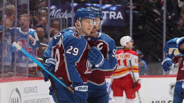 DENVER, COLORADO - APRIL 09: Nathan MacKinnon #29 and Gabriel Landeskog #92 of the Colorado Avalanche celebrate after a goal against the Calgary Flames in the first period at Ball Arena on April 9, 2026 in Denver, Colorado.