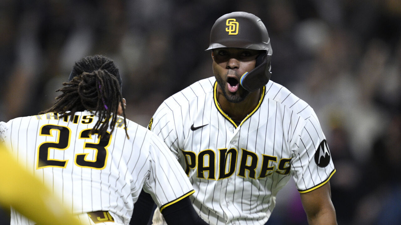SAN DIEGO, CALIFORNIA - APRIL 09: Xander Bogaerts #2 of the San Diego Padres celebrates with Fernando Tatis Jr. #23 after hitting a walk-off grand slam home run during the 12th inning against the Colorado Rockies at Petco Park on April 09, 2026 in San Diego, California.