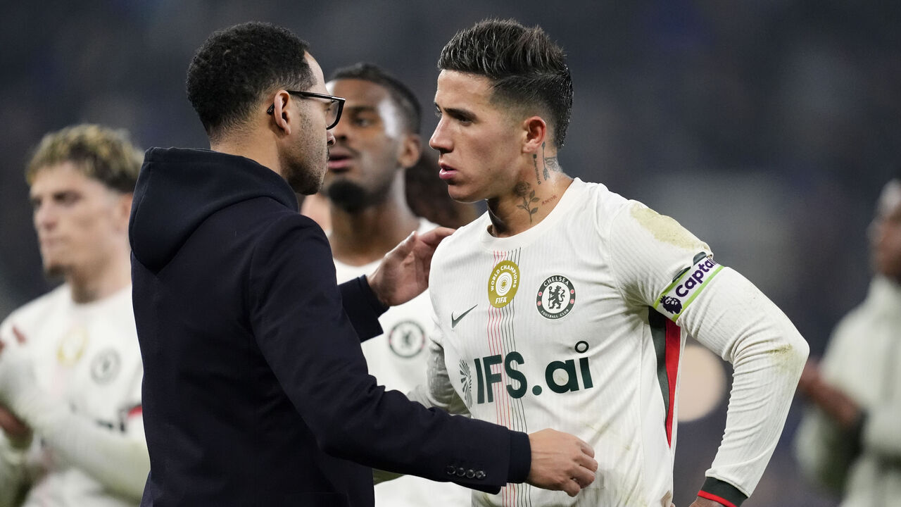 Chelsea manager Liam Rosenior (left) speaks with Enzo Fernandez on the pitch after the Premier League match at Hill Dickinson Stadium, Liverpool. Picture date: Saturday March 21, 2026.