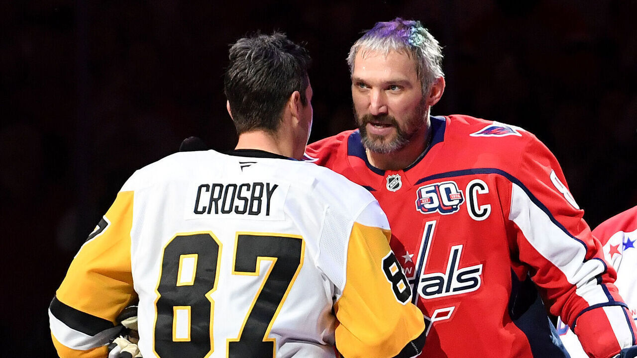 WASHINGTON, DC - NOVEMBER 08: Penguins center Sidney Crosby (87) and Capitals left wing Alexander Alex Ovechkin (8) shake hands after a ceremonial puck drop before the Pittsburgh Penguins versus Washington Capitals National Hockey League game on November 8, 2024 at Capital One Arena in Washington, D.C..
