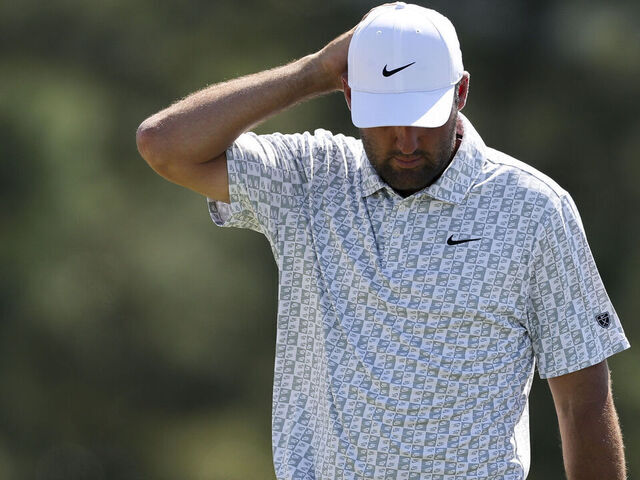 AUGUSTA, GEORGIA - APRIL 10: Scottie Scheffler of the United States reacts on the 18th green during the second round of the 2026 Masters Tournament at Augusta National Golf Club on April 10, 2026 in Augusta, Georgia.