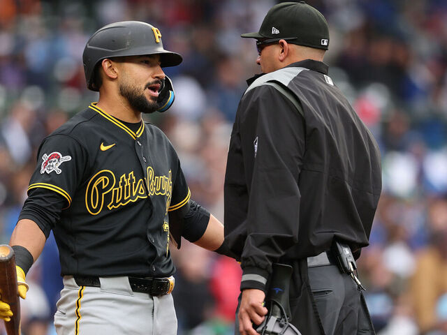 CHICAGO, ILLINOIS - APRIL 10: Nick Gonzales #3 of the Pittsburgh Pirates argues with home plate umpire Roberto Ortiz #40 against the Chicago Cubs at Wrigley Field on April 10, 2026 in Chicago, Illinois.