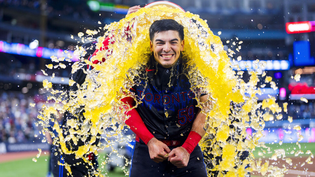 TORONTO, CANADA - APRIL 10: Brandon Valenzuela #59 of the Toronto Blue Jays gets doused in Underarmor sports drink following his team's win against the Minnesota Twins in their MLB game at the Rogers Centre on April 10, 2026 in Toronto, Ontario, Canada.