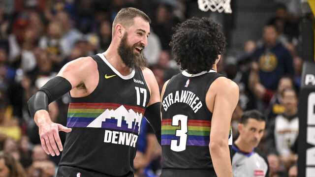 DENVER , CO - APRIL 10: Jonas Valanciunas (17) of the Denver Nuggets celebrates after a dunk by Julian Strawther (3) during the fourth quarter of the Nuggets' 127-107 win over the Oklahoma City Thunder at Ball Arena in Denver, Colorado on Friday, April 10, 2026.