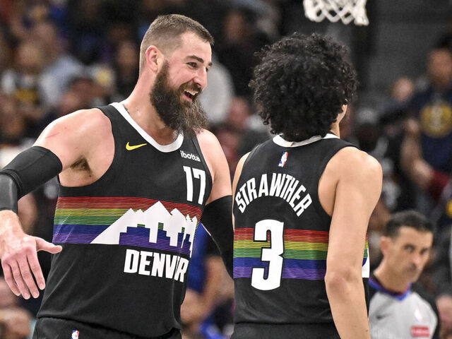 DENVER , CO - APRIL 10: Jonas Valanciunas (17) of the Denver Nuggets celebrates after a dunk by Julian Strawther (3) during the fourth quarter of the Nuggets' 127-107 win over the Oklahoma City Thunder at Ball Arena in Denver, Colorado on Friday, April 10, 2026.
