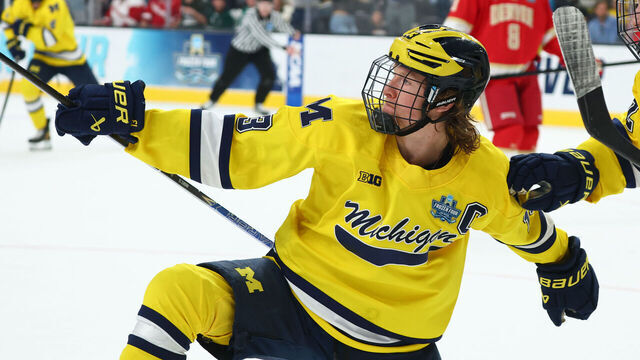 LAS VEGAS, NEVADA - APRIL 9: T.J. Hughes #13 and Adam Valentini #92 of the Michigan Wolverines celebrate after a goal against the Denver Pioneers during the Division I Men's Ice Hockey Championship held at T-Mobile Arena on April 9, 2026 in Las Vegas, Nevada.