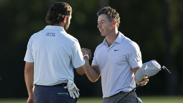 Masters champion Rory McIlroy of Northern Ireland shakes hands with Cameron Young of the United States on the No. 18 hole during the second round of the Masters at Augusta National Golf Club, Friday, April 10, 2026.