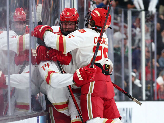 LAS VEGAS, NEVADA - APRIL 9: The Denver Pioneers react after a game-tying goal from Rieger Lorenz #14 of the Denver Pioneers during the Division I Men's Ice Hockey Championship against the Wisconsin Badgers held at T-Mobile Arena on April 9, 2026 in Las Vegas, Nevada.