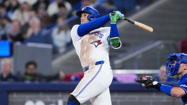 TORONTO, CANADA - APRIL 6: George Springer #4 of the Toronto Blue Jays swings against the Los Angeles Dodgers during the second inning in their MLB game at Rogers Centre on April 6, 2026 in Toronto, Ontario, Canada.