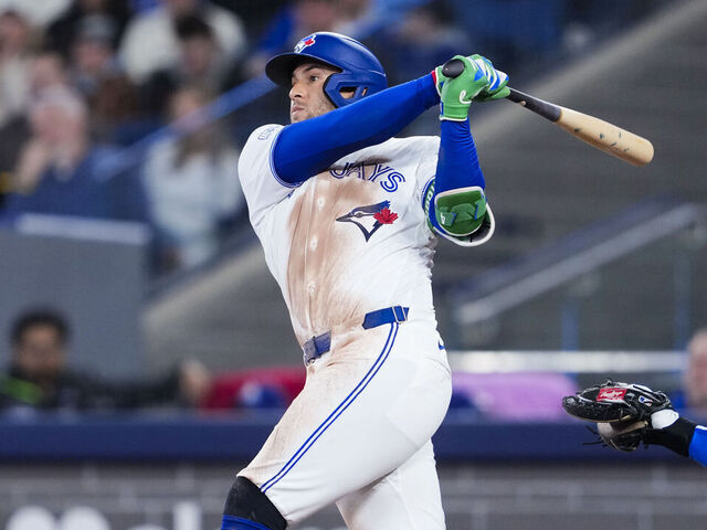 TORONTO, CANADA - APRIL 6: George Springer #4 of the Toronto Blue Jays swings against the Los Angeles Dodgers during the second inning in their MLB game at Rogers Centre on April 6, 2026 in Toronto, Ontario, Canada.