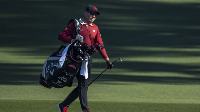 Masters champion Sergio Garcia of Spain carries his bag as he walks off the fairway on the No. 2 hole during the final round of the Masters at Augusta National Golf Club, Sunday, April 12, 2026.