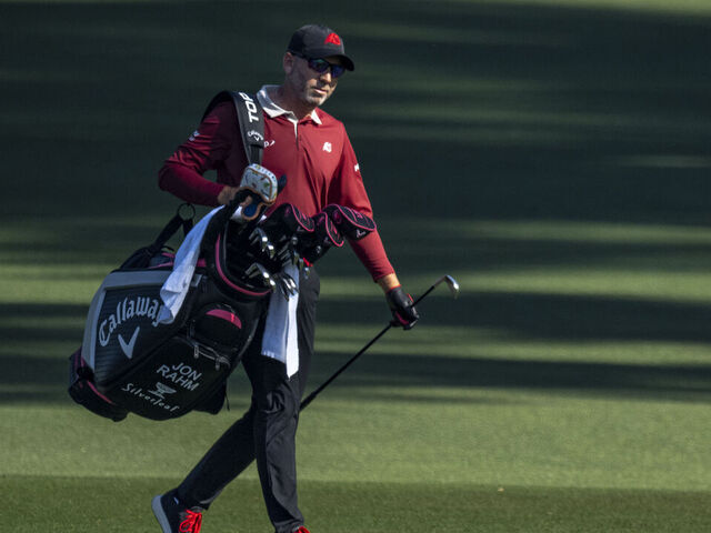 Masters champion Sergio Garcia of Spain carries his bag as he walks off the fairway on the No. 2 hole during the final round of the Masters at Augusta National Golf Club, Sunday, April 12, 2026.