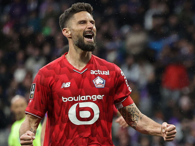 Lille's French forward #09 Olivier Giroud celebrates after scoring during the French L1 football match between Toulouse FC and Lille LOSC at the TFC Stadium in Toulouse, southwestern France, on April 12, 2026.