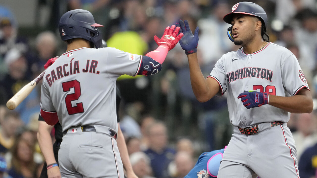 MILWAUKEE, WISCONSIN - APRIL 12: James Wood #29 of the Washington Nationals celebrates with teammate Luis García Jr. #2 after hitting a solo home run during the fourth inning against the Milwaukee Brewers at American Family Field on April 12, 2026 in Milwaukee, Wisconsin.
