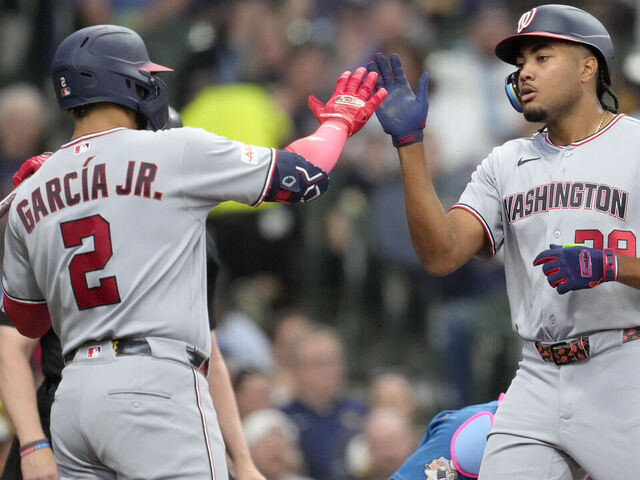 MILWAUKEE, WISCONSIN - APRIL 12: James Wood #29 of the Washington Nationals celebrates with teammate Luis García Jr. #2 after hitting a solo home run during the fourth inning against the Milwaukee Brewers at American Family Field on April 12, 2026 in Milwaukee, Wisconsin.