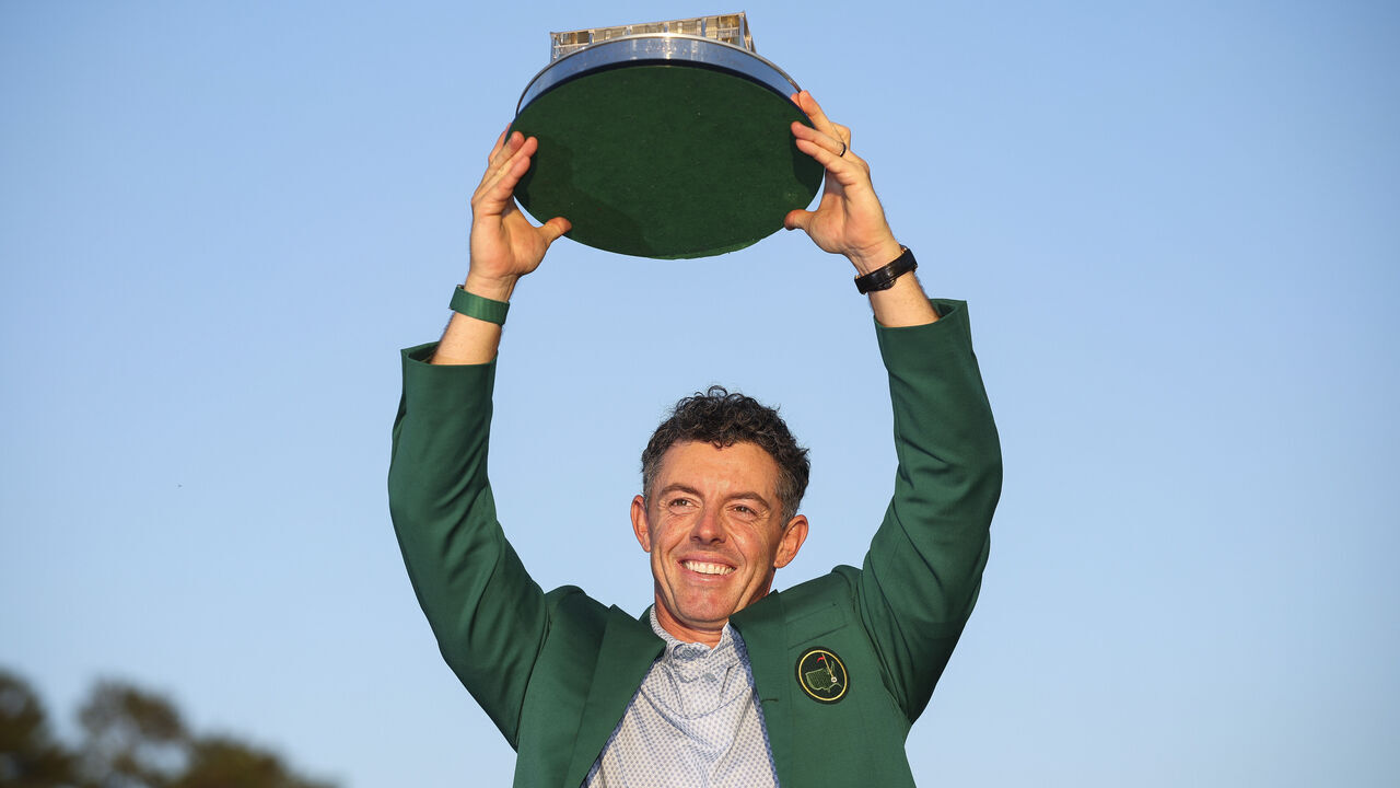 AUGUSTA, GEORGIA - APRIL 12: Rory McIlroy of Northern Ireland lifts the Masters trophy during the Green Jacket Ceremony after winning the final round of the 2026 Masters Tournament at Augusta National Golf Club on April 12, 2026 in Augusta, Georgia.