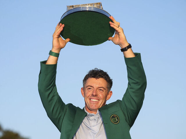 AUGUSTA, GEORGIA - APRIL 12: Rory McIlroy of Northern Ireland lifts the Masters trophy during the Green Jacket Ceremony after winning the final round of the 2026 Masters Tournament at Augusta National Golf Club on April 12, 2026 in Augusta, Georgia.