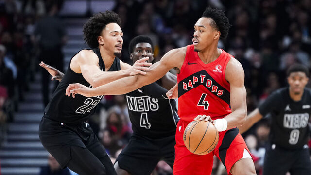 TORONTO, CANADA - APRIL 12: Scottie Barnes #4 of the Toronto Raptors dribbles against Jalen Wilson #22 of the Brooklyn Nets during the first half at Scotiabank Arena on April 12, 2026 in Toronto, Ontario, Canada. NOTE TO USER: User expressly acknowledges and agrees that, by downloading and/or using this Photograph, user is consenting to the terms and conditions of the Getty Images License Agreement.