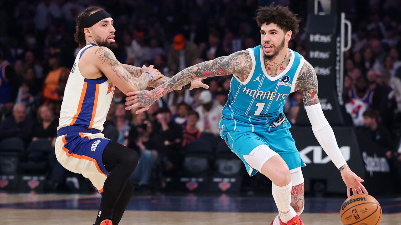 NEW YORK, NEW YORK - APRIL 12: LaMelo Ball #1 of the Charlotte Hornets dribbles while defended by Jose Alvarado #5 of the New York Knicks during the first half at Madison Square Garden on April 12, 2026 in New York City.