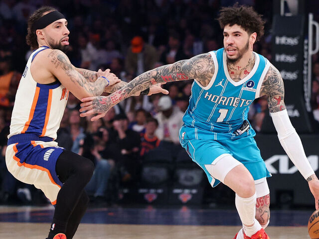 NEW YORK, NEW YORK - APRIL 12: LaMelo Ball #1 of the Charlotte Hornets dribbles while defended by Jose Alvarado #5 of the New York Knicks during the first half at Madison Square Garden on April 12, 2026 in New York City.