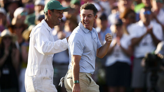 AUGUSTA, GEORGIA - APRIL 12: Rory McIlroy of Northern Ireland and his caddie Harry Diamond celebrate winning the final round of the 2026 Masters Tournament on the 18th green at Augusta National Golf Club on April 12, 2026 in Augusta, Georgia.