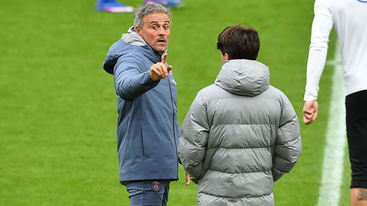 Paris Saint-Germain's Spanish head coach Luis Enrique (L) takes a team training session at Anfield stadium in Liverpool, north-west England on April 13, 2026, on the eve of their UEFA Champions League, quarter final second leg football match against Liverpool.
