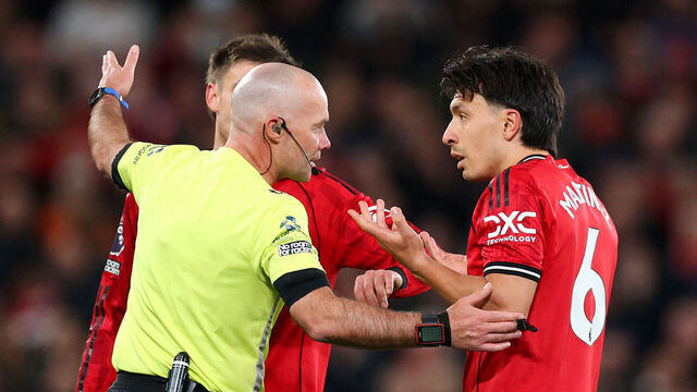 MANCHESTER, ENGLAND - APRIL 13: Referee Paul Tierney speaks with Lisandro Martinez of Manchester United after showing him a red card for pulling the hair of Dominic Calvert-Lewin of Leeds United during the Premier League match between Manchester United and Leeds United at Old Trafford on April 13, 2026 in Manchester, England.