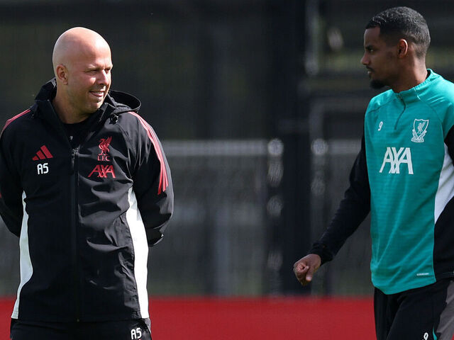 KIRKBY, ENGLAND - APRIL 13: Arne Slot, Manager of Liverpool, speaks with Alexander Isak of Liverpool during a Liverpool FC Training Session at AXA Training Centre on April 13, 2026 in Kirkby, England.