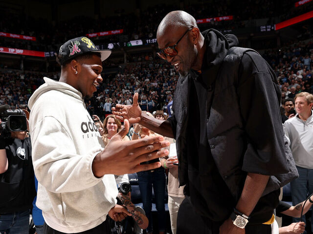 MINNEAPOLIS, MN - APRIL 12: Kevin Garnett and Anthony Edwards #5 of the Minnesota Timberwolves high five before the game against the New Orleans Pelicans on April 12, 2026 at Target Center in Minneapolis, Minnesota. Mandatory Copyright Notice: Copyright 2026 NBAE