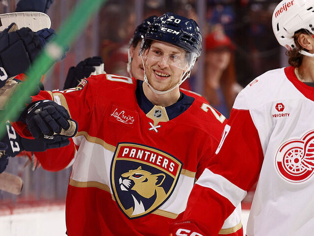 SUNRISE, FLORIDA - APRIL 15: Mike Benning #20 of the Florida Panthers celebrates his goal with teammates against the Detroit Red Wings at the Amerant Bank Arena on April 15, 2026 in Sunrise, Florida.