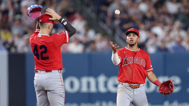 NEW YORK, NEW YORK - APRIL 15: Oswald Peraza #2 and Zach Neto #9 of the Los Angeles Angels react after allowing a pop up to fall in the infield during the ninth inning of the game against the New York Yankees at Yankee Stadium on April 15, 2026 in New York City. All players are wearing the number 42 in honor of Jackie Robinson Day.