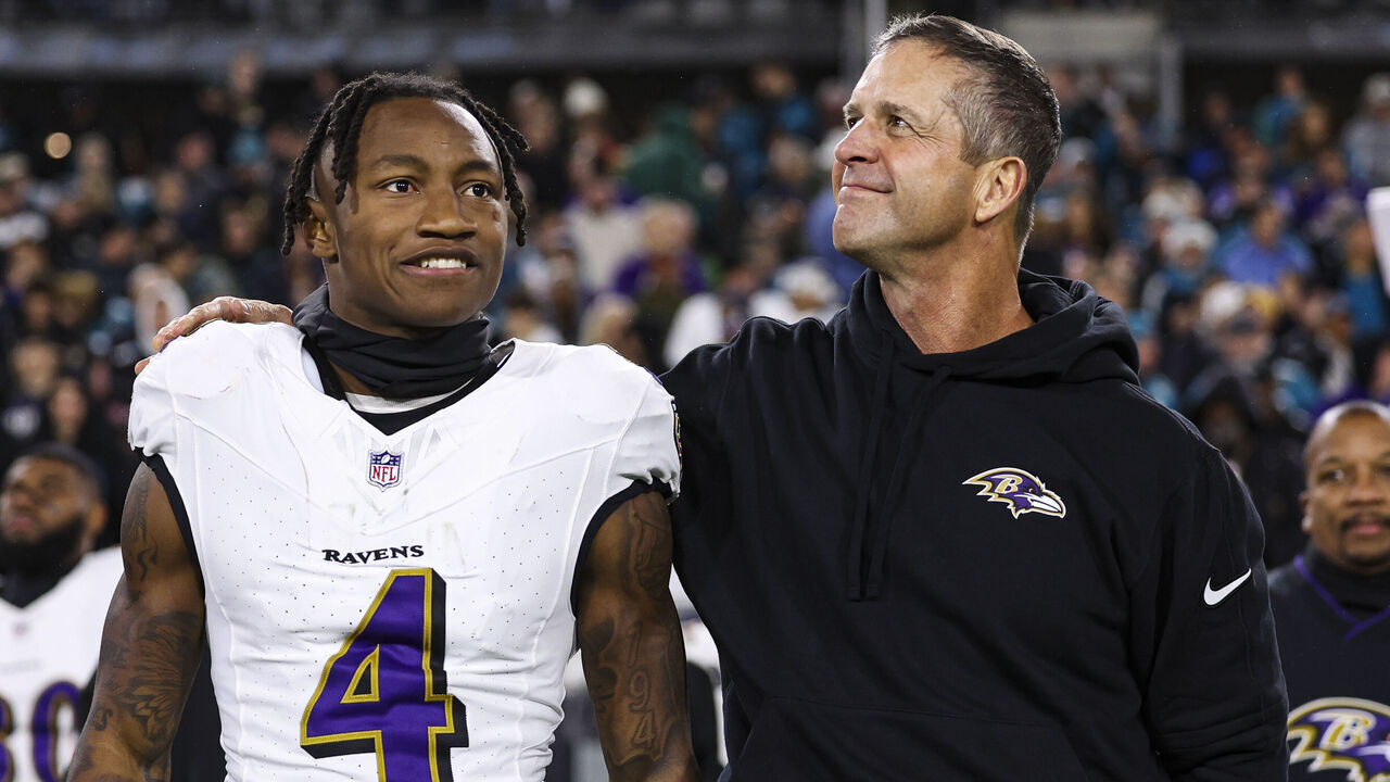 JACKSONVILLE, FL - DECEMBER 17: Zay Flowers #4 of the Baltimore Ravens and John Harbaugh look on from the sideline during the national anthem prior to an NFL football game against the Jacksonville Jaguars at EverBank Stadium on December 17, 2023 in Jacksonville, Florida.