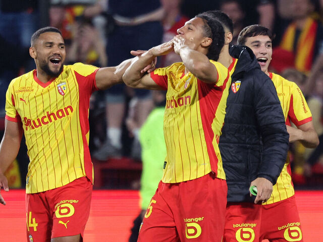 Lens' French defender Pierre Ismaelo Ganiou (C) celebrates with teammates after scoring a goal during the French L1 football match between RC Lens and Toulouse FC at the Stade Bollaert-Delelis in Lens, northern France, on April 17, 2026.
