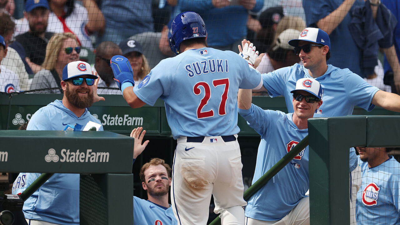CHICAGO, ILLINOIS - APRIL 17: Seiya Suzuki #27 of the Chicago Cubs high fives manager Craig Counsell #11 of the Chicago Cubs after scoring a run during the seventh inning against the New York Mets at Wrigley Field on April 17, 2026 in Chicago, Illinois.