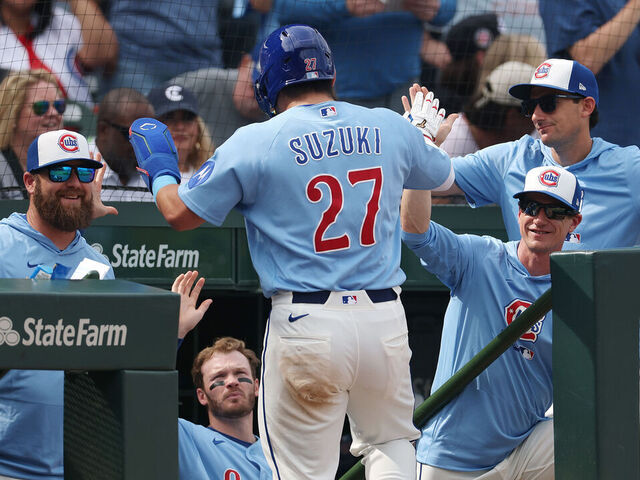 CHICAGO, ILLINOIS - APRIL 17: Seiya Suzuki #27 of the Chicago Cubs high fives manager Craig Counsell #11 of the Chicago Cubs after scoring a run during the seventh inning against the New York Mets at Wrigley Field on April 17, 2026 in Chicago, Illinois.