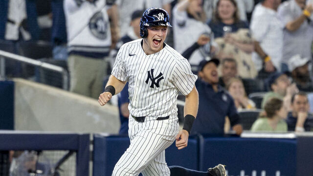 BRONX, NY - APRIL 17: New York Yankees first baseman Ben Rice (22) celebrates the 2-run home run of New York Yankees third baseman Ryan McMahon (19) during the MLB professional baseball game between the Kansas City Royals and New York Yankees at Yankee Stadium in New York, NY.
