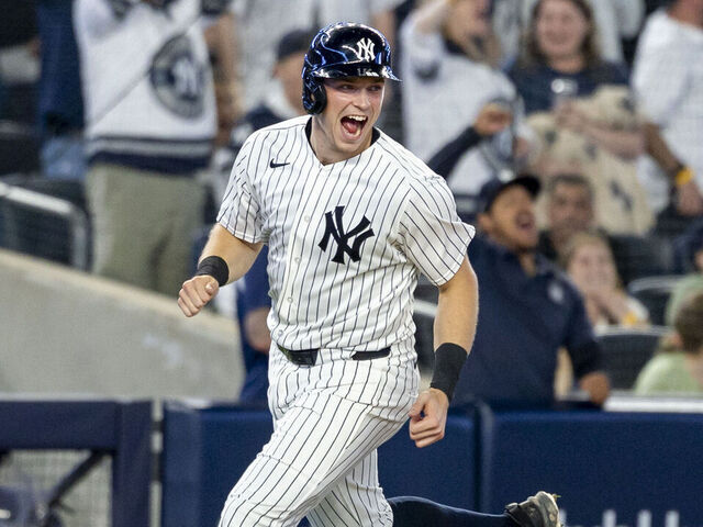BRONX, NY - APRIL 17: New York Yankees first baseman Ben Rice (22) celebrates the 2-run home run of New York Yankees third baseman Ryan McMahon (19) during the MLB professional baseball game between the Kansas City Royals and New York Yankees at Yankee Stadium in New York, NY.